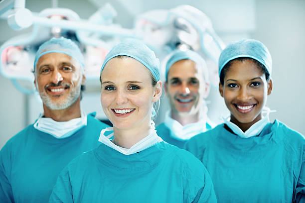 istock Young female doctor smiling with team 117145586