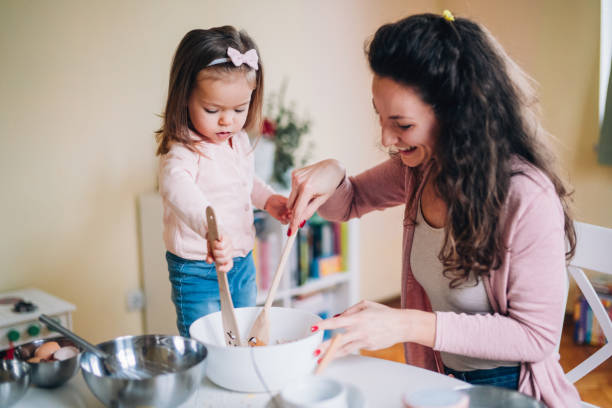 istock Happy mother and daughter in kitchen 1171457330