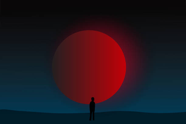 istock illustration of loneliness man with big red moon on the planet 1171457611