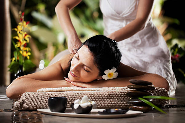 istock Woman getting a massage at tropical spa 117145821