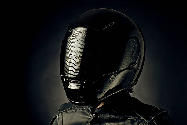 accident portrait Biker after an accident. Helmet and jacket show hits. crash helmet stock pictures, royalty-free photos & images