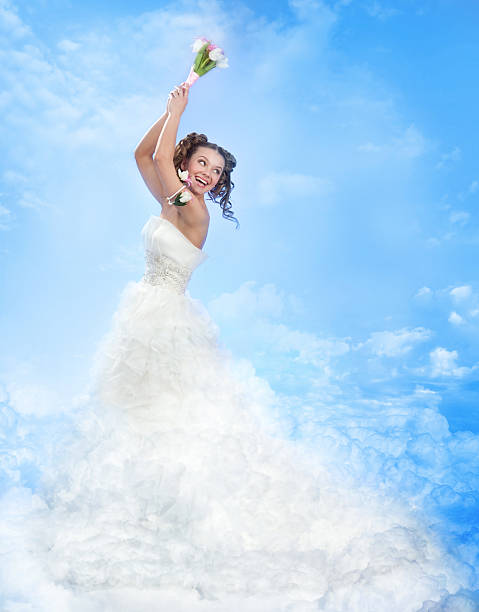 A Happy Laughing Bride Throwing a Bouquet over the Shoulder. The Bride Standing on Clouds. Please, view my BRIDE'S series below: