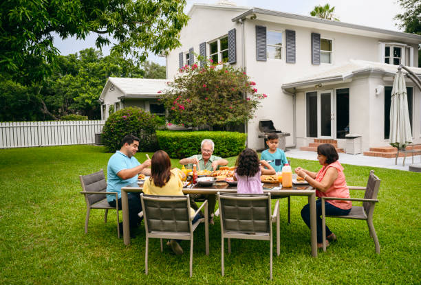 istock Hispanic family enjoying summer barbecue lunch in backyard 1171461073