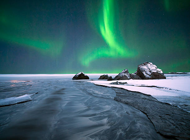 arctic ocean aurora. - austvagoy stock-fotos und bilder