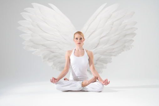 beautiful blonde girl dressed as a black angel on a black background