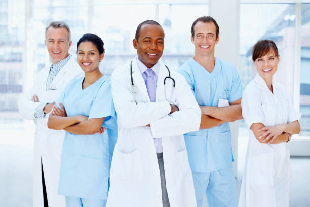 istock Doctor standing proud with his team 117146676