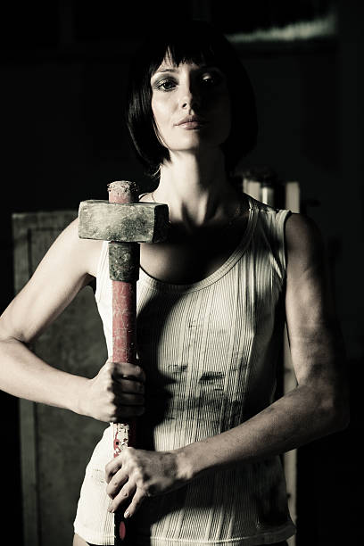 istock Young woman holding big hammer 117146686