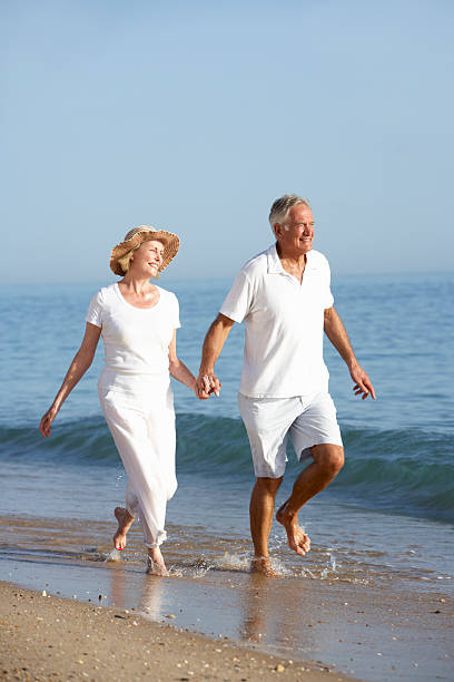 istock Senior Couple Enjoying Beach Holiday 117146737