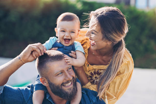 istock Mother, father and baby on a walk 1171468720