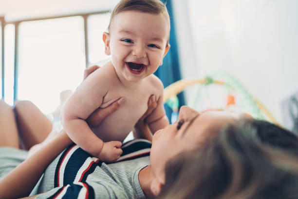 istock Mother and baby playing together 1171468724