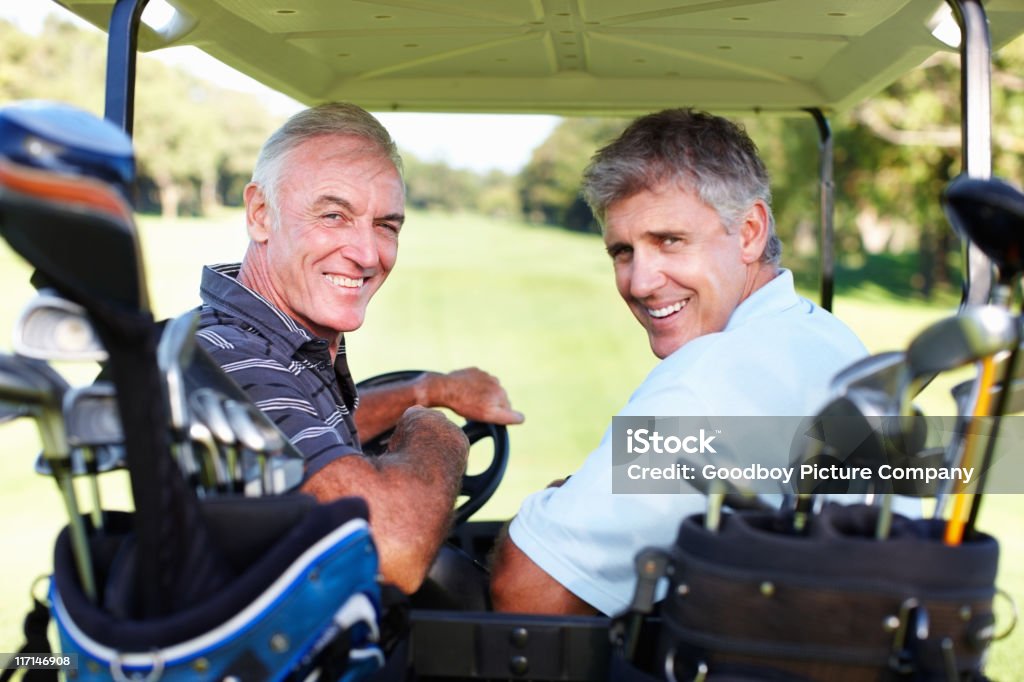 Lächelnd Golfer in einem golf-buggy - Lizenzfrei Golfspieler Stock-Foto