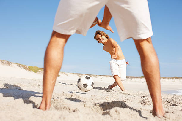 istock Father and son playing soccer 117146940