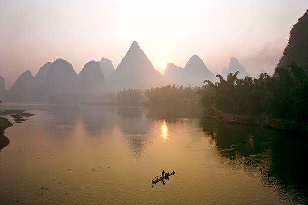 istock Fisherman on Li River at dawn, China 117147001