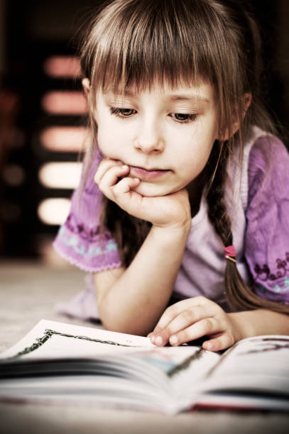 istock Beautiful little girl reading 117147212