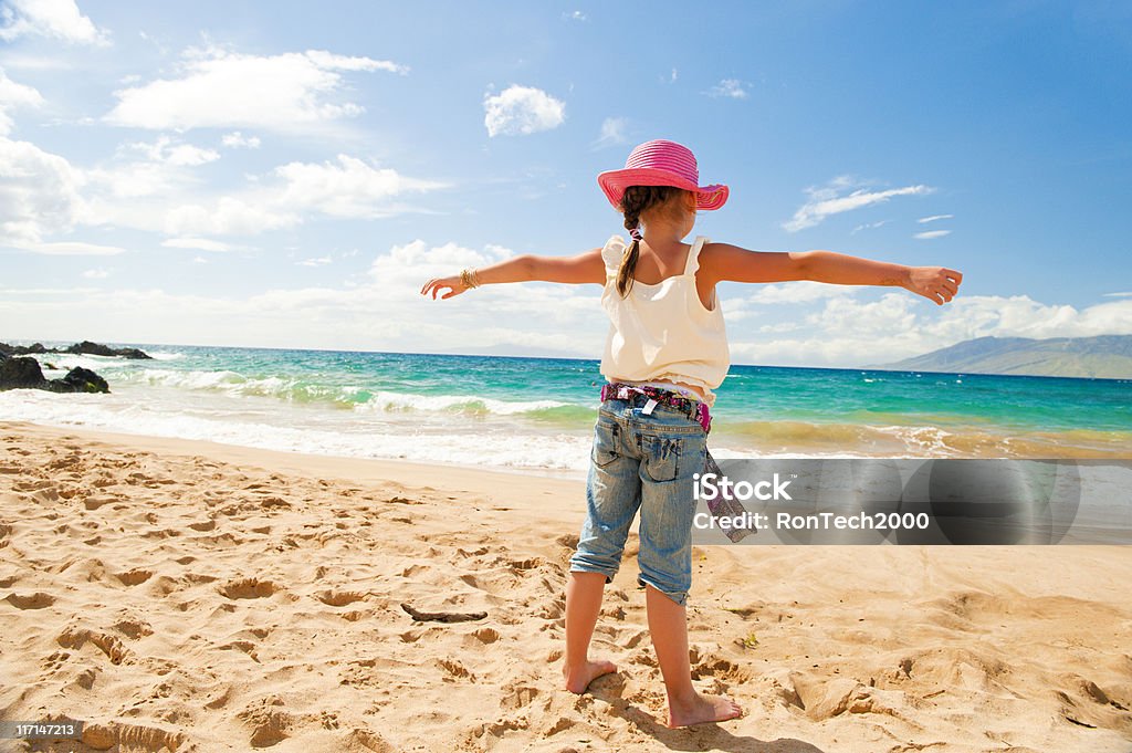 Beach Freedom the joy of the beach / warmth of the sun on your arms / and carefree childhood 6-7 Years Stock Photo
