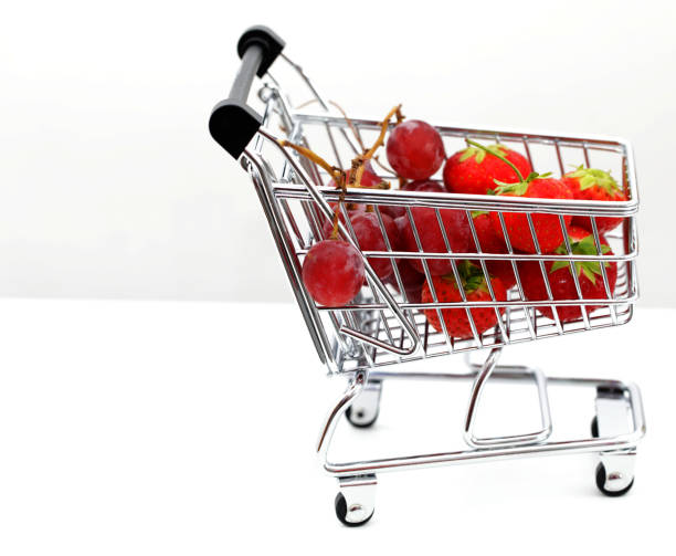 istock shopping trolley and basket with fresh fruit 1171472365
