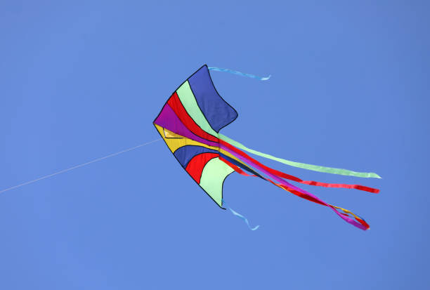 istock colorful kite flies high in the sky 1171472589