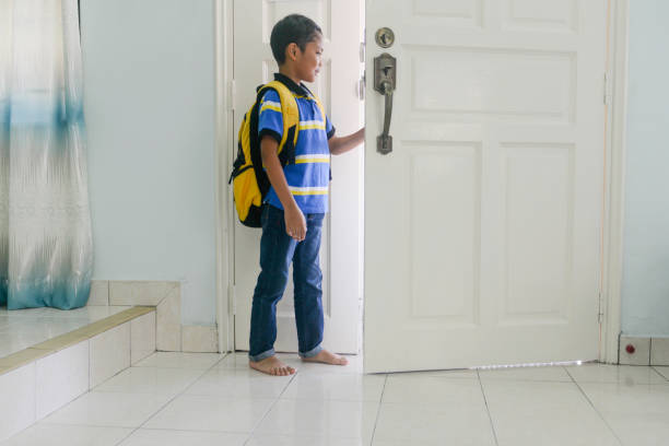 istock Asian young boy getting ready to go to the school 1171473461