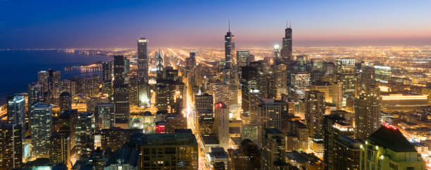 Aerial Panoramic View of Chicago at Dusk (XXXL) Aerial panoramic view of downtown Chicago and beyond shortly after sunset. aon center chicago photos stock pictures, royalty-free photos & images