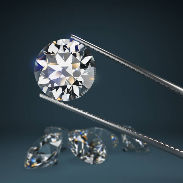 istock diamond in tweezers 1171473731