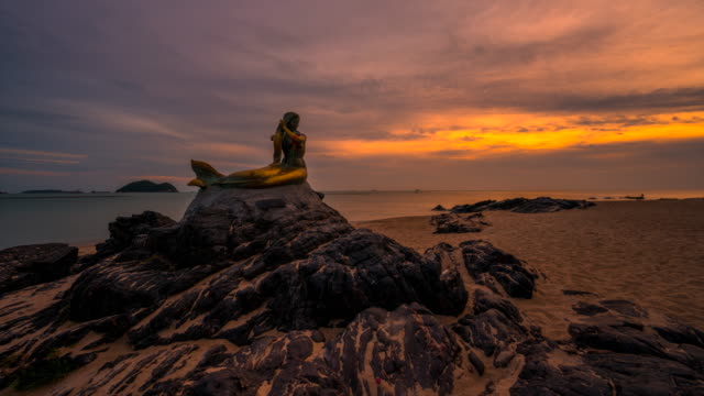 Time lapse Sunrise Scene of Mermaid Statue, Famous Travel Place in Songkhla, Thailand