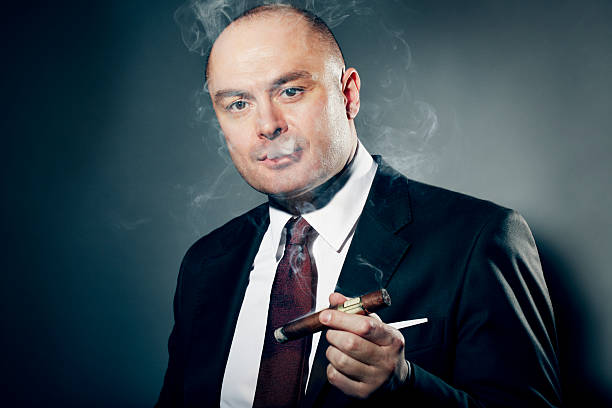 istock Dramatic Portrait of Cigar Smoker 117147396