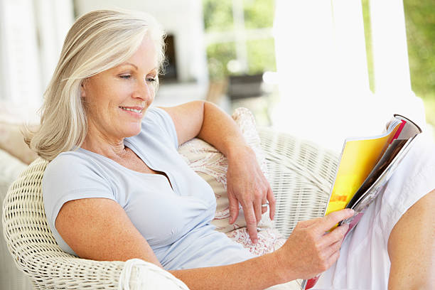 Senior woman reading outside