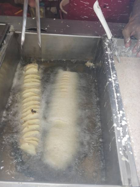 istock Spiral chopped potatoes are fried in deep fry 1171474722