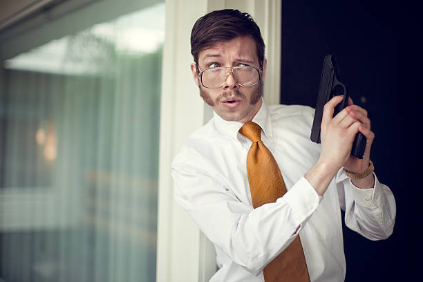 istock Retro Secret Agent Waiting with Pistol 117147517