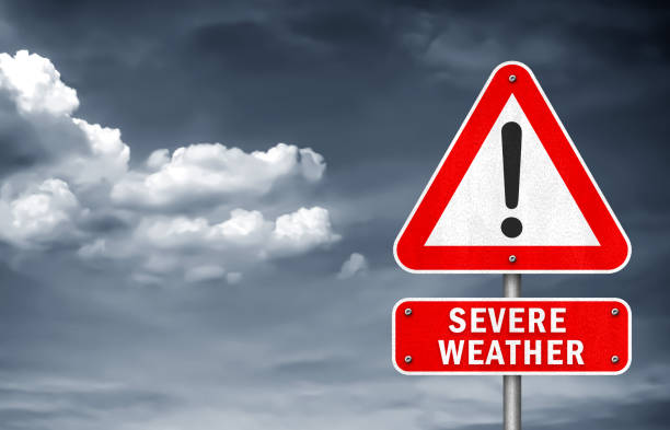 ciężka pogoda - ostrzeżenie o znaku drogowym - hurricane stock illustrations