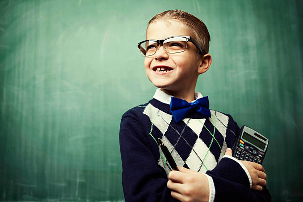 istock Young Boy Dressed as Nerd Smiles in Classroom 117147606