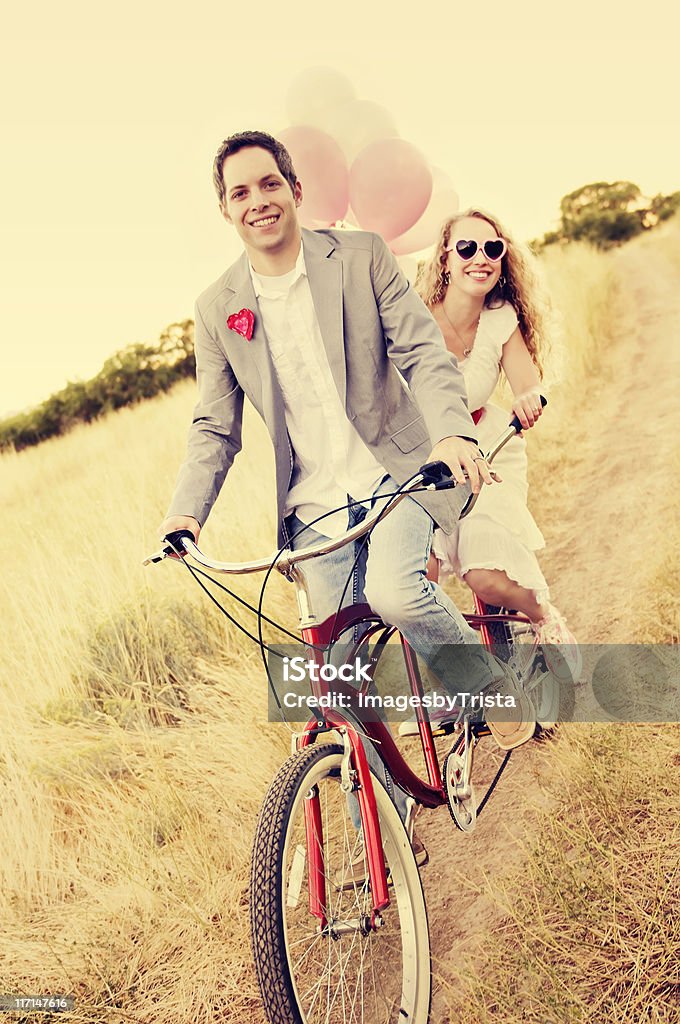 Couple on a Beach Cruiser  Couple - Relationship Stock Photo