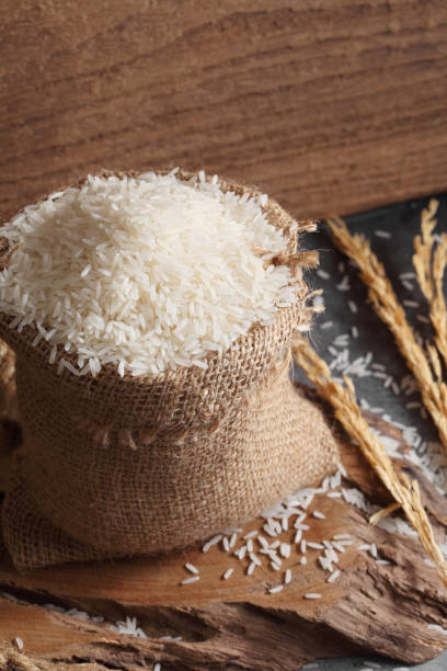 istock Close up Thai white jasmine rice in sack bag in kitchen with a blank space for a text 1171476595