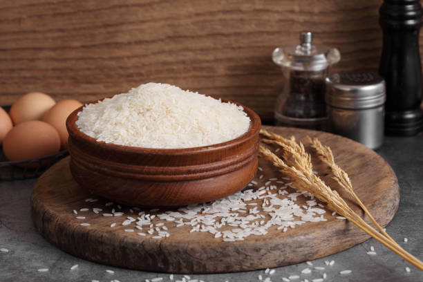 istock Thai white jasmine rice in wooden bowl in kitchen with a blank space for a text 1171476604