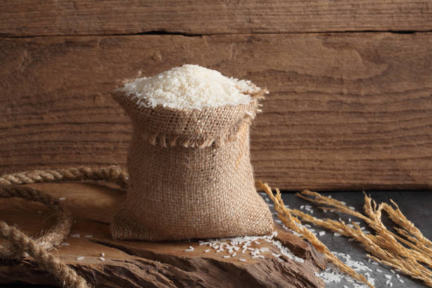 istock Thai white jasmine rice in sack bag in kitchen with a blank space for a text 1171476609