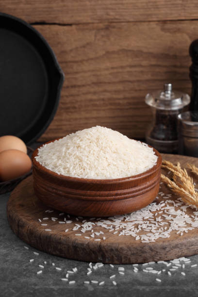 istock Thai white jasmine rice in wooden bowl in kitchen with a blank space for a text 1171476617