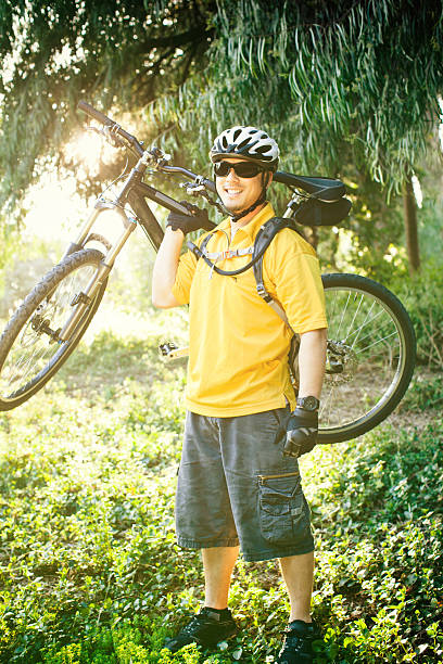 istock Mountain biker holding bike on sholder 117147738
