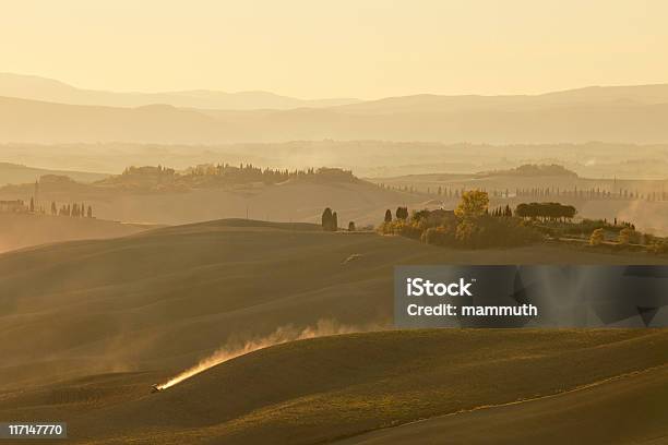 Seeding And Harrowing Tractor Between The Hills Of Tuscany Stock Photo - Download Image Now