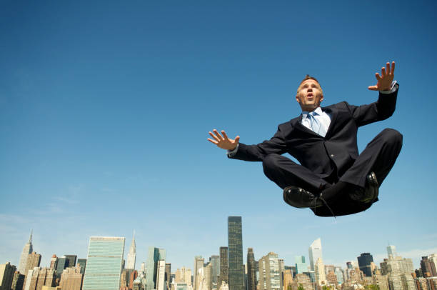 istock Levitating Businessman Balances Above City Skyline 117147991