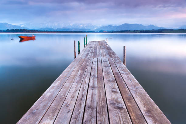 istock tranquil scene with boat at lake hopfensee 117148039