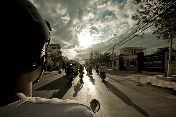 Saint Petersburg, Russia, July 30, 2024.Beautiful powerful motorcycles among parked cars in the city center on the river embankment, shot with a wide-format lens, surrounding houses, cityscape, interesting view, summer.