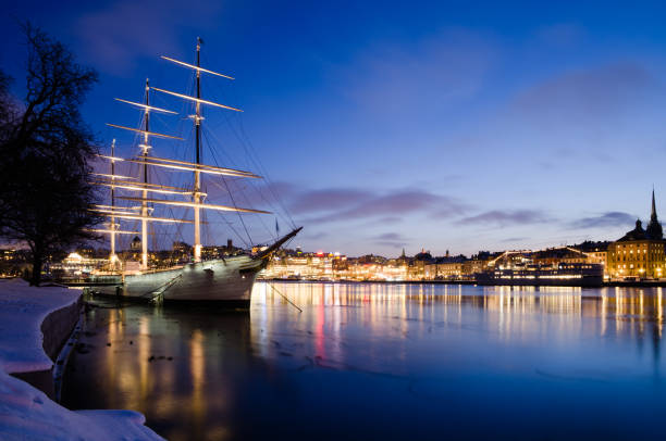 A sailboat rests quietly moored along Stockholm’s scenic waterfront.