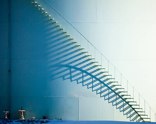 White Staircase and Shadow on Oil Storage Tank  ethanol stock pictures, royalty-free photos & images