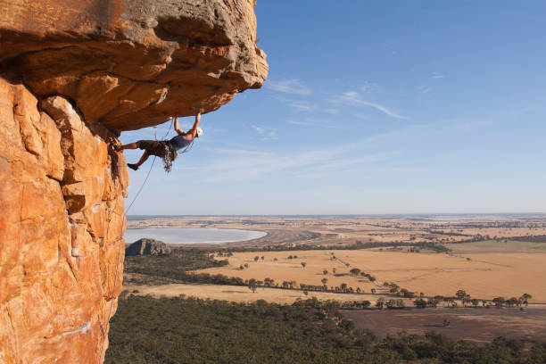 Man rock climbing stock photo