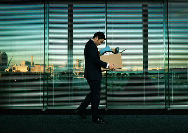 Asian Office Worker Leaving His Job in Layoff for Recession stock photo