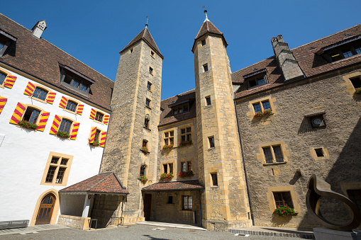 Neuchatel, Switzerland - September 09, 2015: Courtyard of the castle, architectural buildings date back to the 12th century. The Castle of Neuchatel is a Swiss heritage site of national significance. This is one of the countless wonderful places in Switzerland, which is a tourist attraction often visited by many tourists from all over the world.