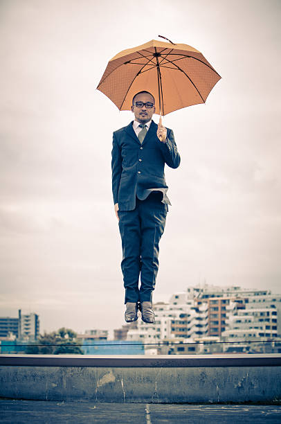 Photo portrait of attractive young man umbrella rainy forehead hand search wear trendy classic clothes isolated on red color background.