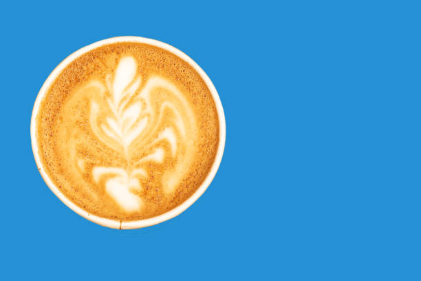 istock Coffee in a paper cup latte art on blue background. 1171483895