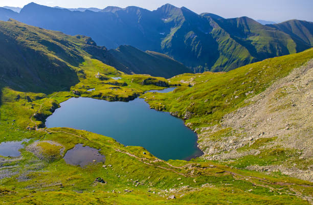 istock Mountain summer lake in alpine area 1171483944