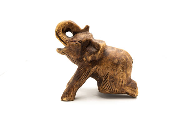 istock Wooden elephant on white background. Side shot lay concept. 1171483961